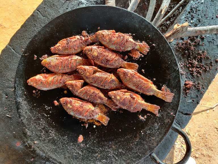 Oistin Fish Fry | Fish frying in a pan | Evolve Tours