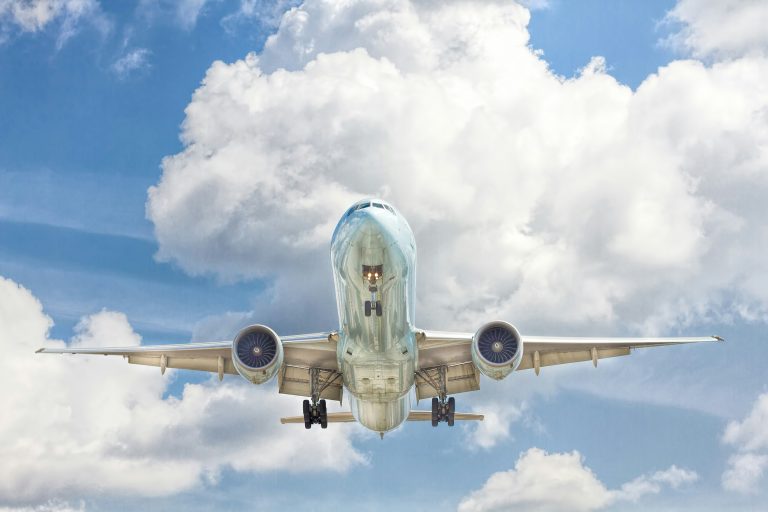Best Reasons to Travel | Airplane flying overhead | Evolve Tours