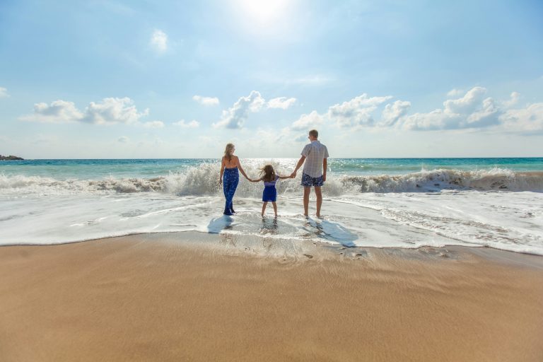 Why Kids Should Travel | Aerial view of family at the beach | Evolve Tours