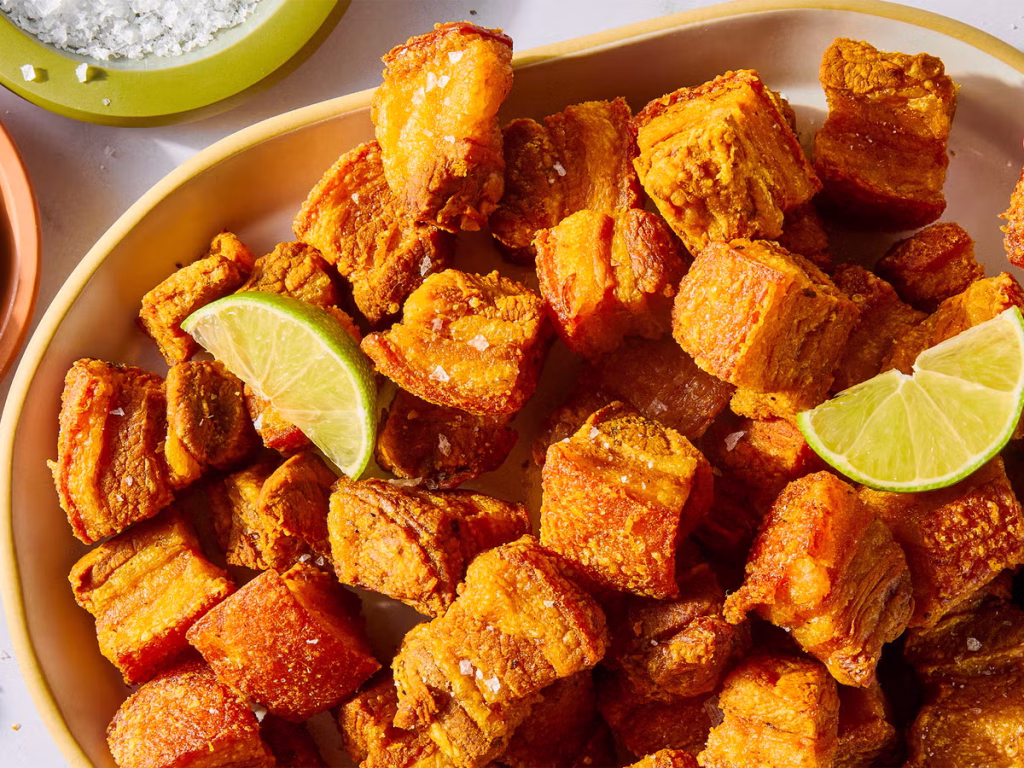 Lima Food | Bowl of chicharrón with lime slices | Evolve Tours