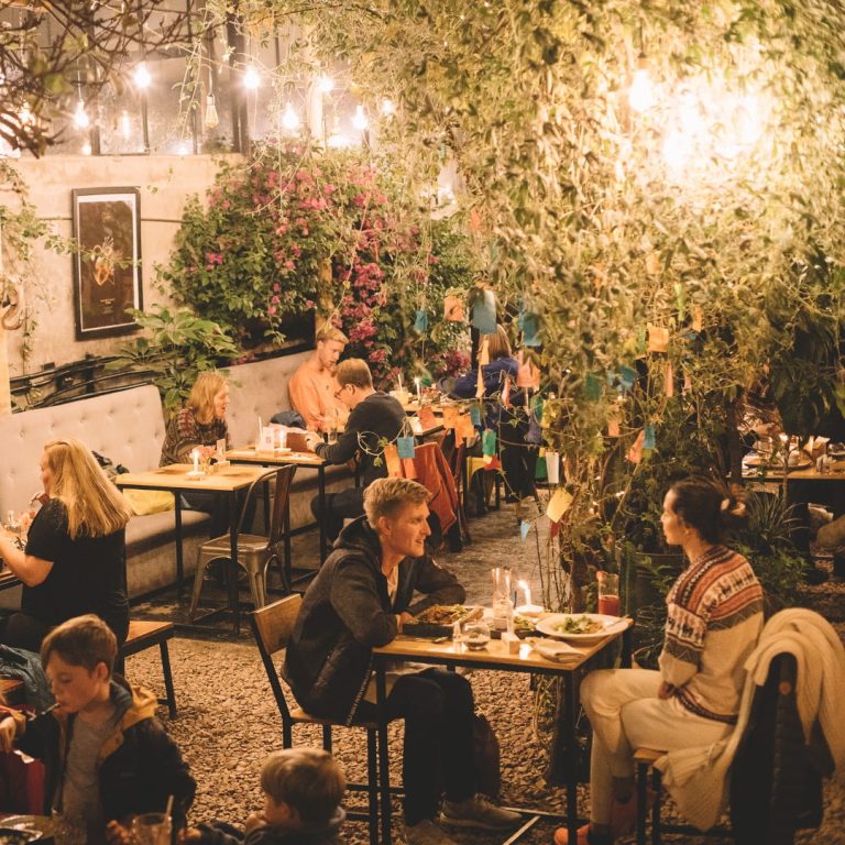 Vegan in Cusco | Garden patio at Green Point restaurant | Evolve Tours