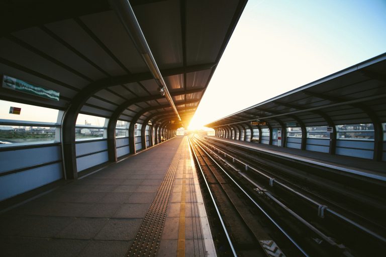 Planes Trains and Automobiles | Train station platform | Evolve Tours