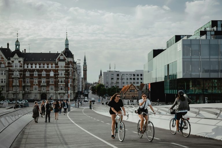 Copenhagen Biking | People biking on a bridge in Copenhagen | Evolve Tours