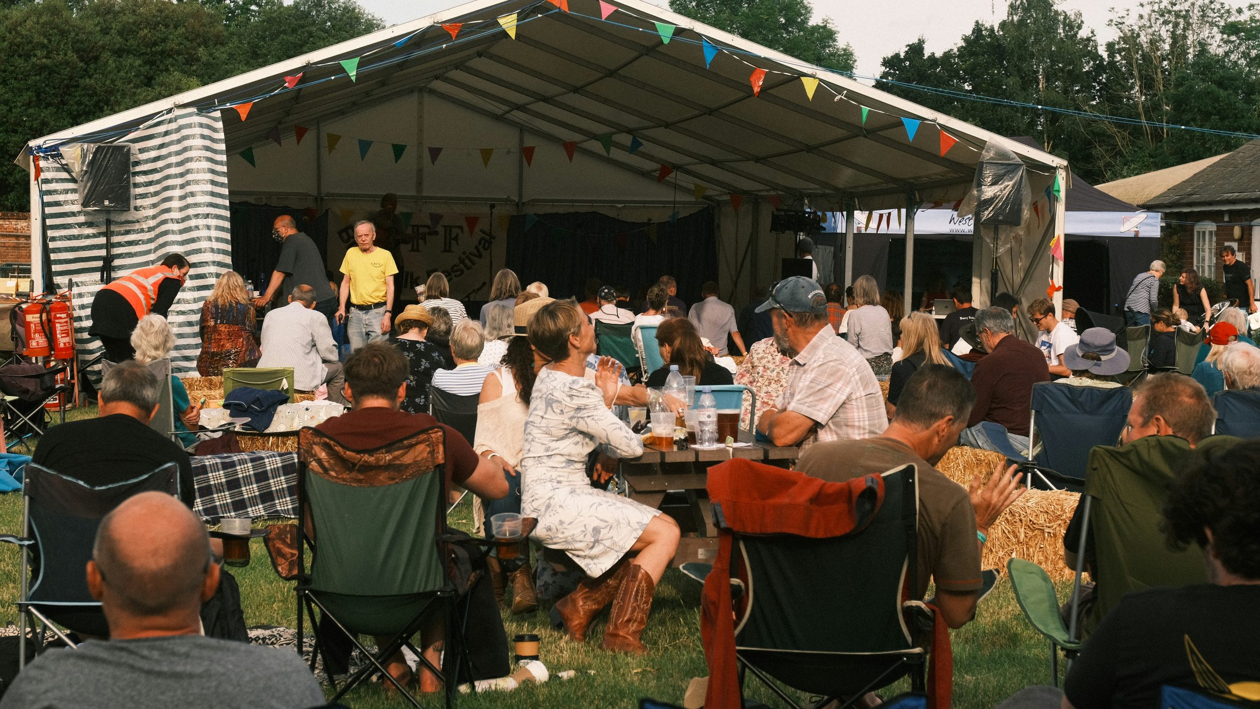 Family-Friendly Festivals | People at picnic tables in park | Evolve Tours