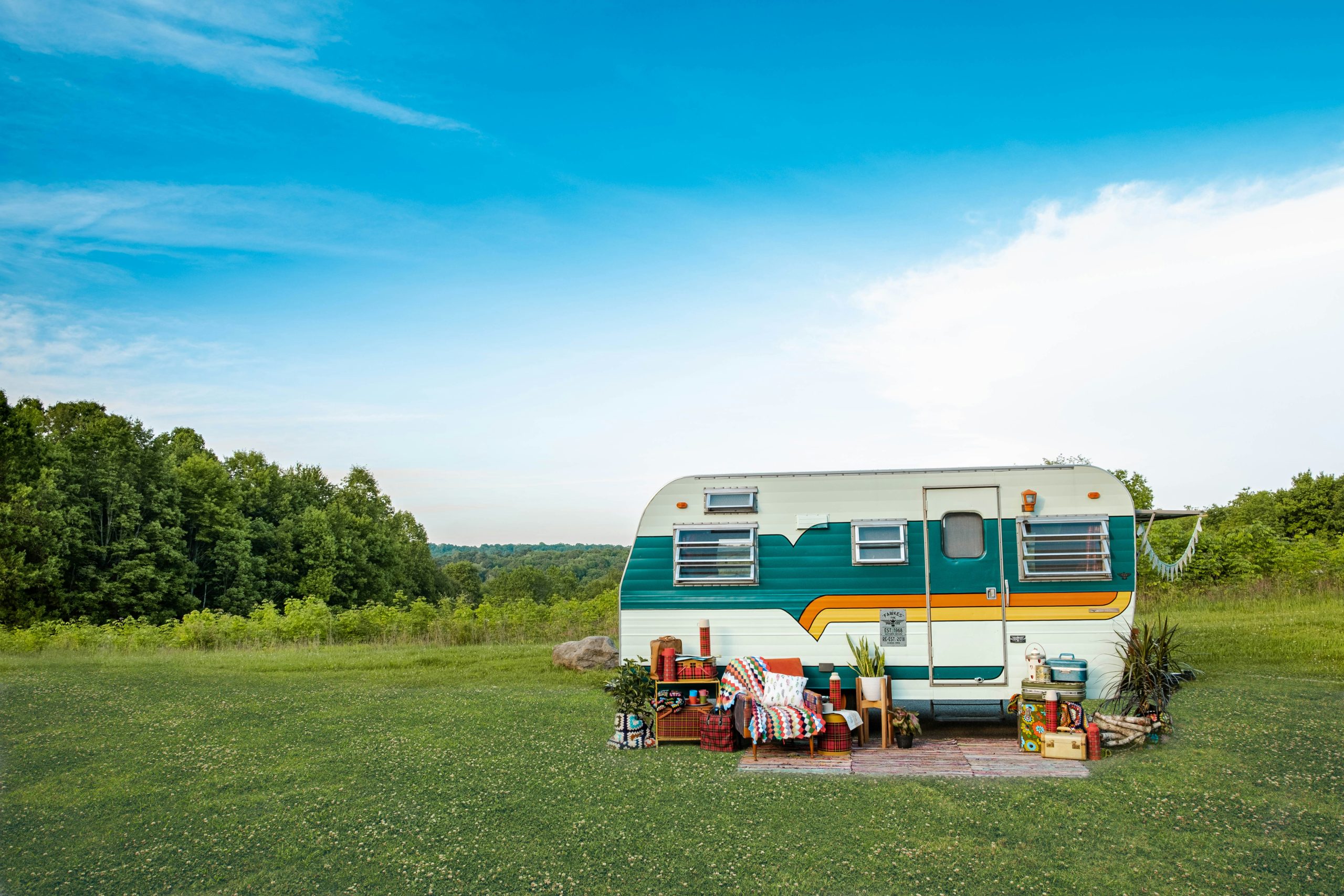 RV Parks in Eastern Canada | RV parked in grassy field | Evolve Tours