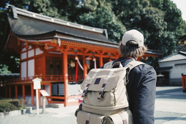 Japan Culture for Students | Man looking at temple | Evolve Tours