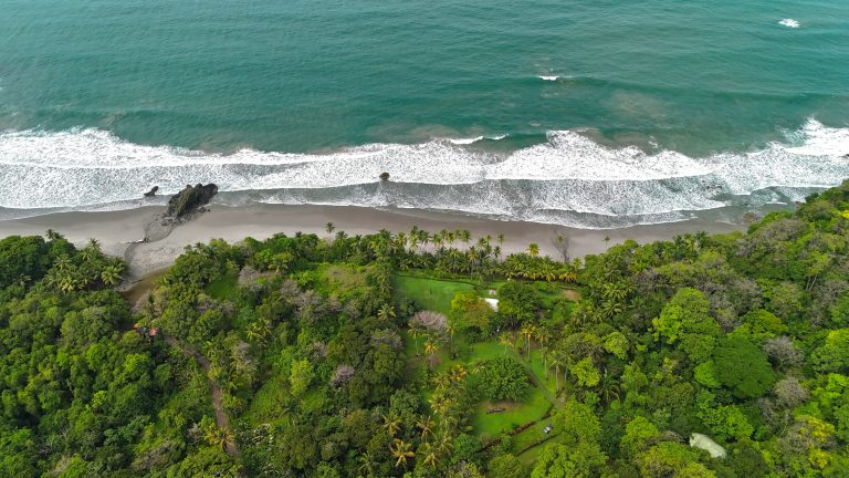 Costa Rica School Trip | Aerial view of coastline with beach and rainforest | Evolve Tours